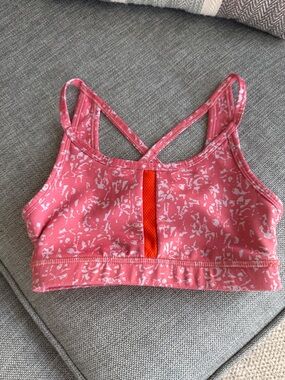 Nike Pink Patterned Strappy Kids Sports Bra with Orange Detail